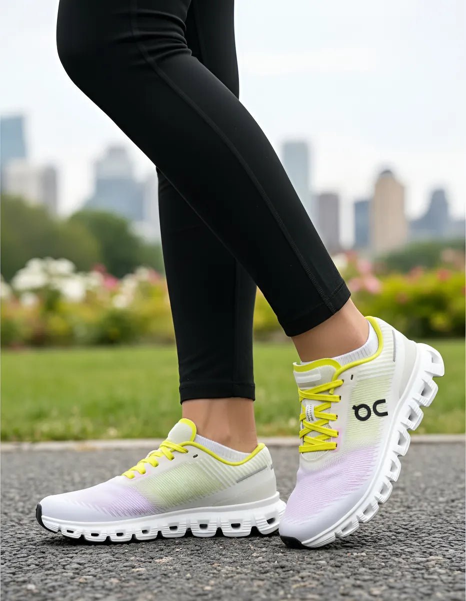 On Cloud 6 Push sports shoes in pink and yellow by JMK OUTLET, showcasing a modern design and breathable fabric.