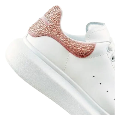 Alexander McQueen oversized casual sneakers in gold and rose with crystal accents.