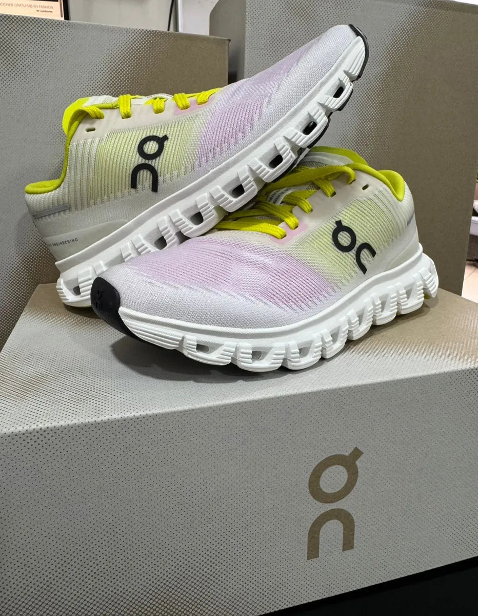JMK OUTLET On Cloud 6 Push sports shoes in vibrant pink and yellow, showcasing a modern athletic design.
