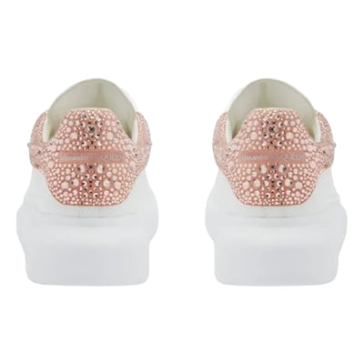 Alexander McQueen oversized casual sneakers in gold and rose with crystal details.