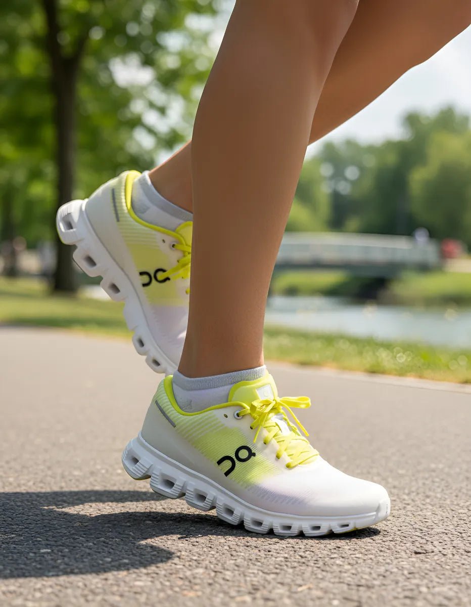 On Cloud 6 Push sports shoes in pink and yellow by JMK OUTLET, featuring a sleek design and breathable material.