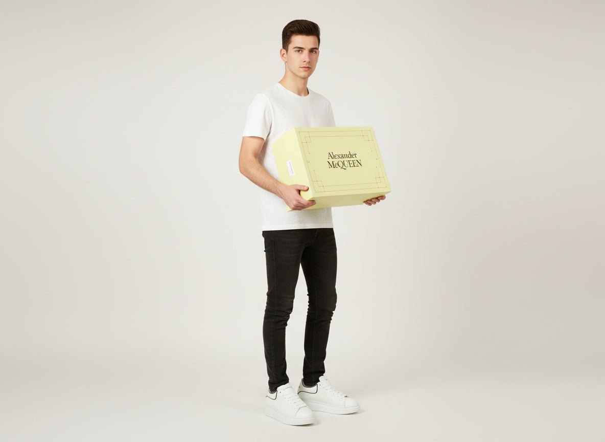 Casual white sneakers by Alexander McQueen featuring a sleek design and premium materials for a modern look.